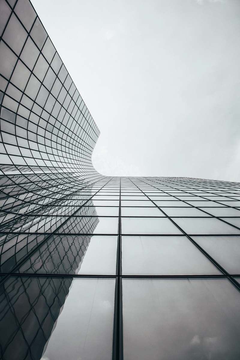 high rise clear glass walled high-rise building office building